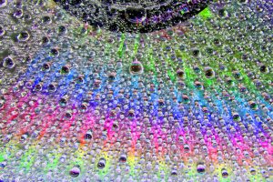 Many bubbles with smiling faces and colored background.